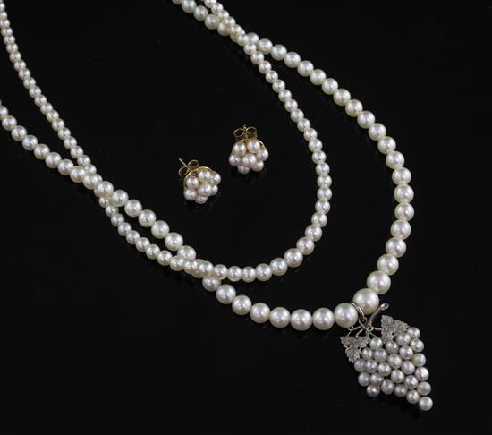 A 15ct gold and platinum cultured pearl pendant, on cultured pearl necklace and a pair of earrings.